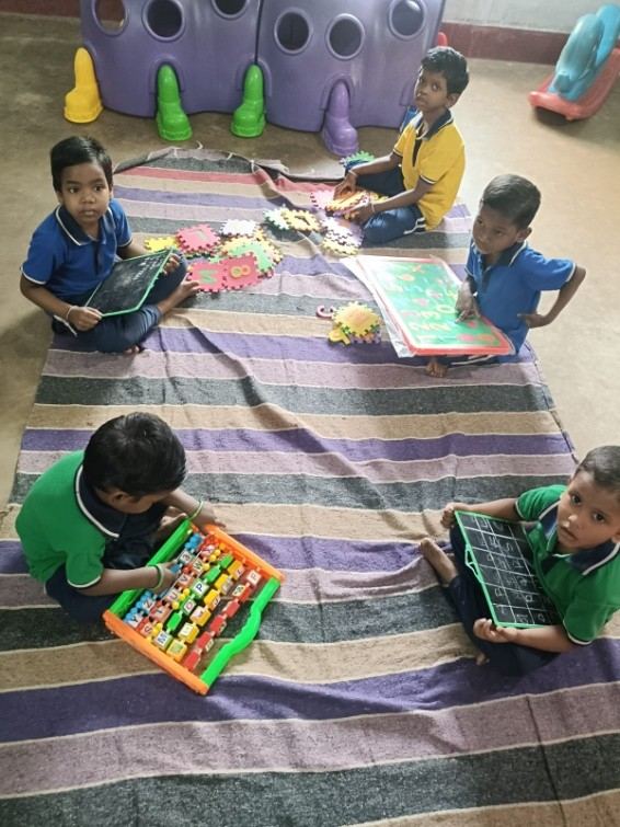 Children taking part in an educational activity at Servindia Children's Home